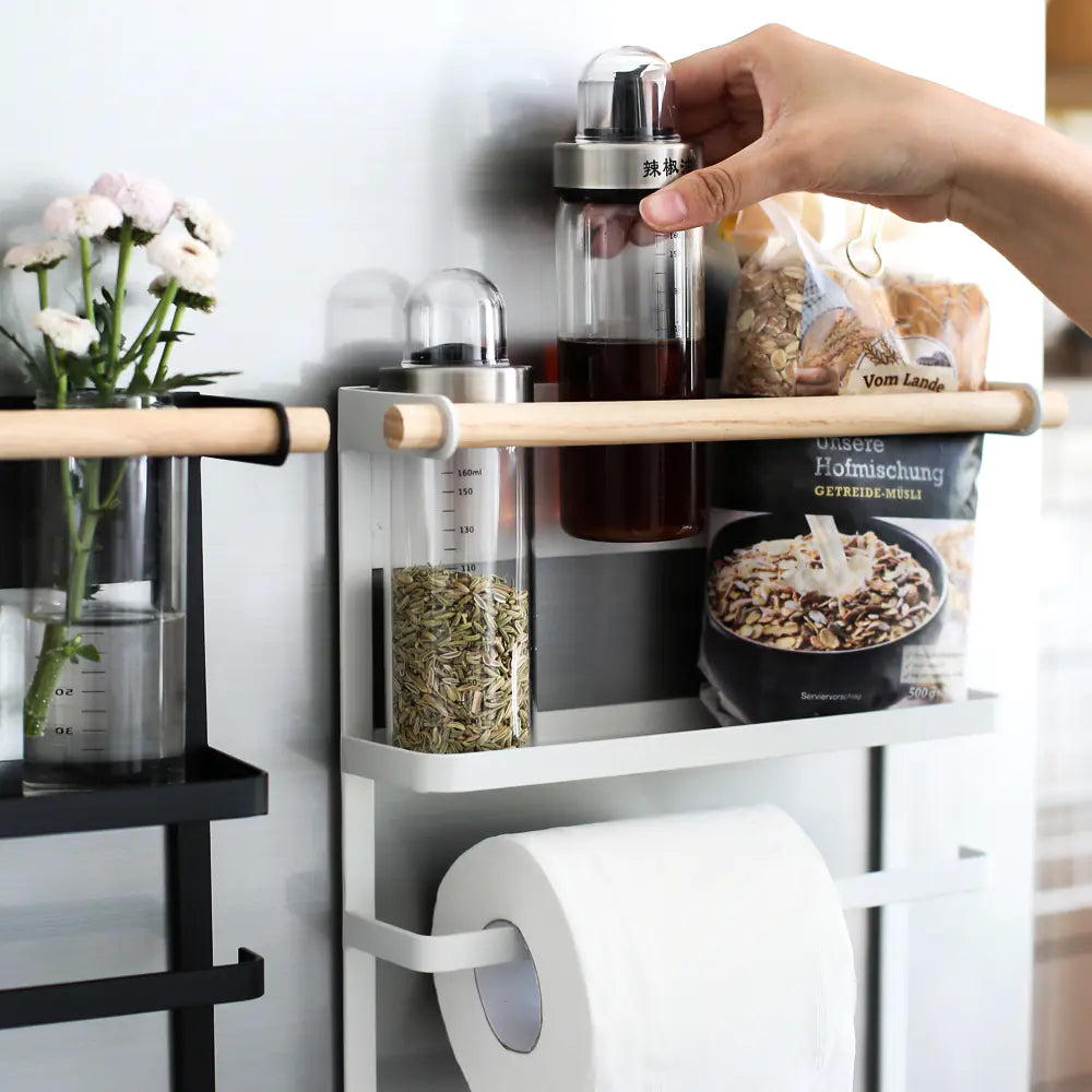 Wall-mounted kitchen storage rack with spice jars, towel holder and multipurpose shelf | Fixxora