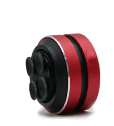 Portable BassDrop mini speaker with red metallic band and black front shown at an angle