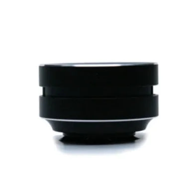 Small portable BassDrop speaker in black shown from the side profile