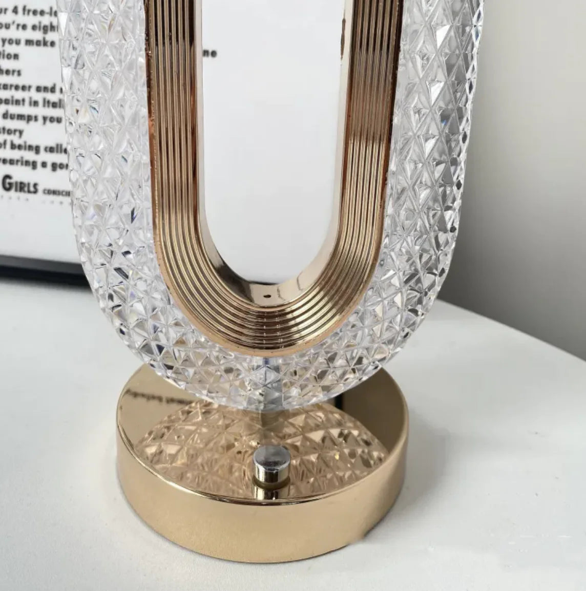 Close-up view of LuxeGlow lamp’s sparkling crystal oval design with golden base