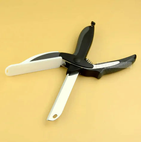 Multi-purpose kitchen scissor knife placed on yellow background with blade open
