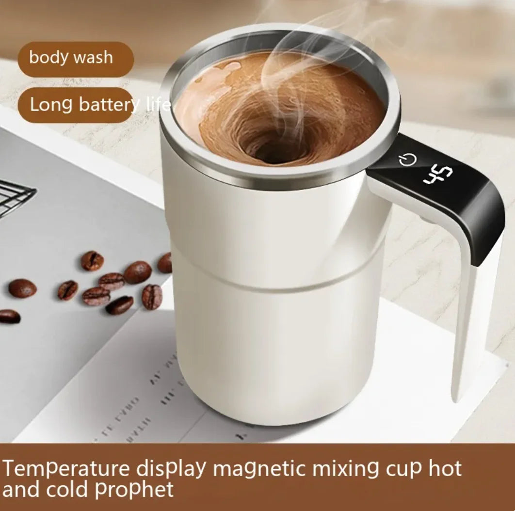 White 380ml smart magnetic self-stirring mug with swirling coffee inside on table with coffee beans