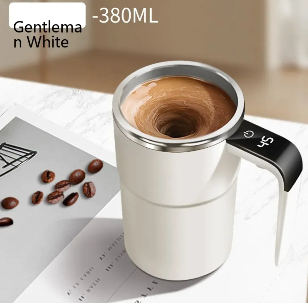 White smart self-stirring mug with black handle and swirling coffee inside