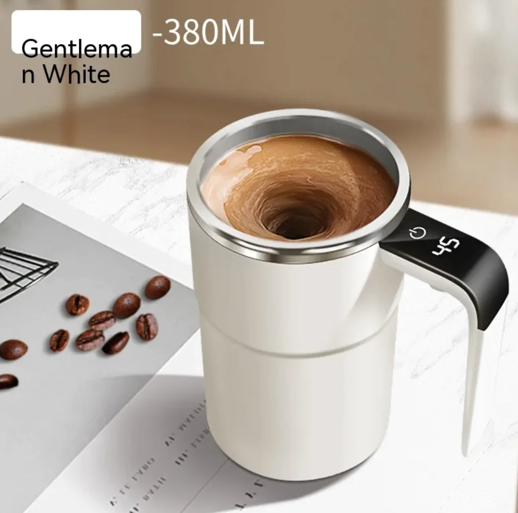 White smart self-stirring mug with coffee swirling inside shown from top angle