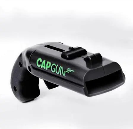 Black CapGun bottle opener and cap launcher isolated on white background.