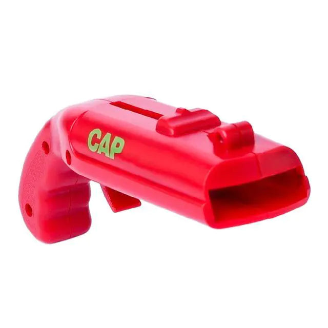 Red CapGun bottle opener and cap launcher close-up on white background.