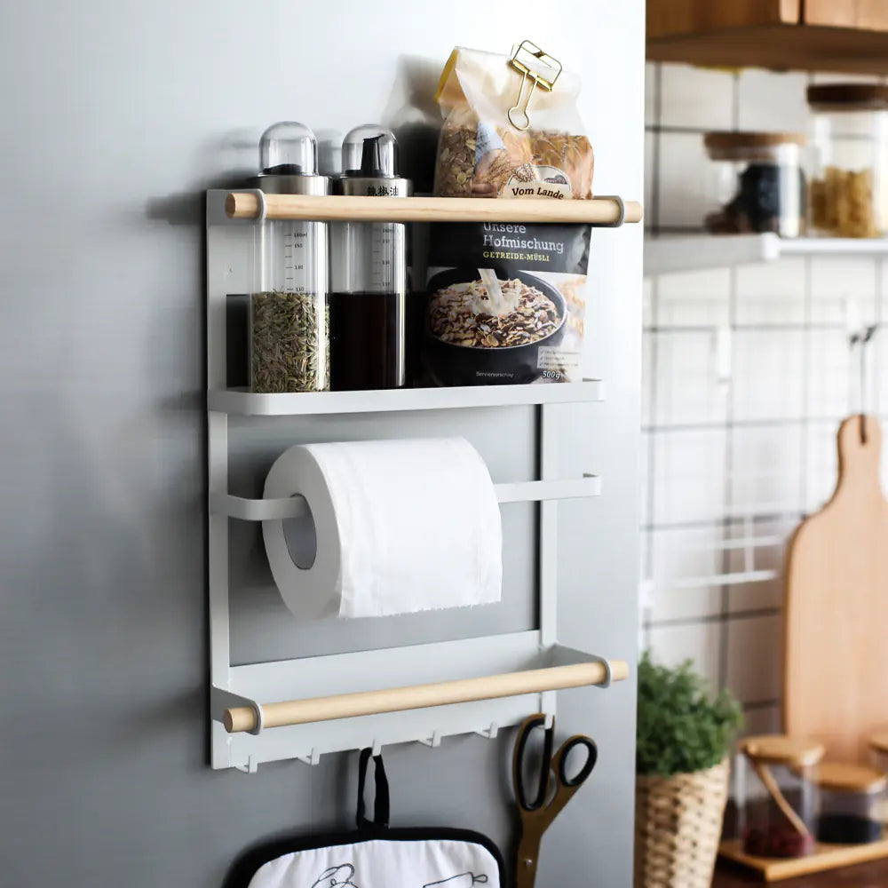 Wall-mounted kitchen storage rack with spice jars, towel holder and multipurpose shelf | Fixxora